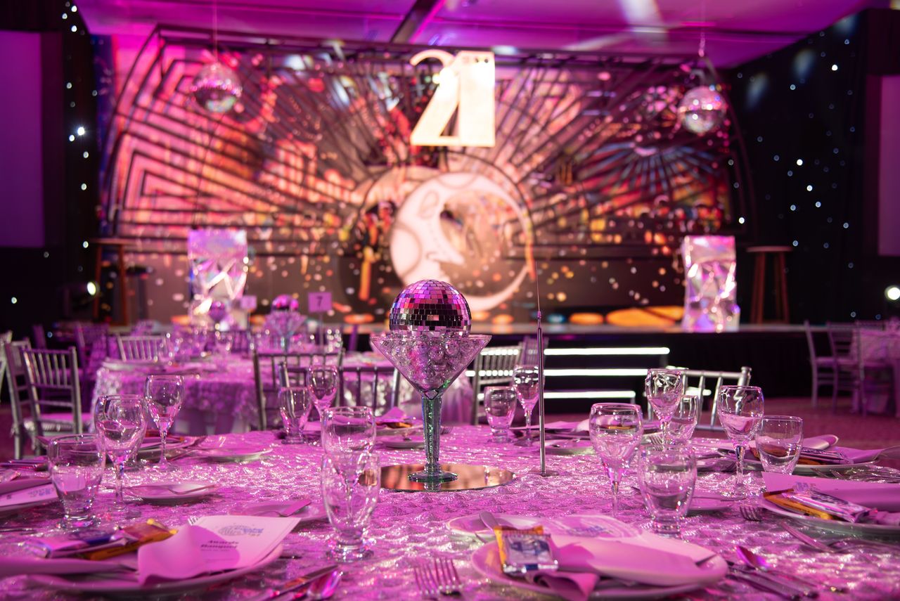 Crafting Captivating Headlines: Your awesome post title goes here Luxurious dining setup for a 21st birthday party with a sparkling modern theme.